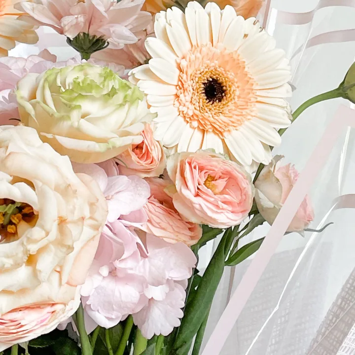 Pastel mixed bouquet in soft wrap